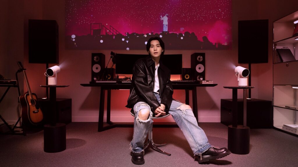 231011 Samsung TV: What makes SUGA’s off-days better? The new features of The Freestyle 2nd Gen! See how it elevates his screen experience, straight from his couch.