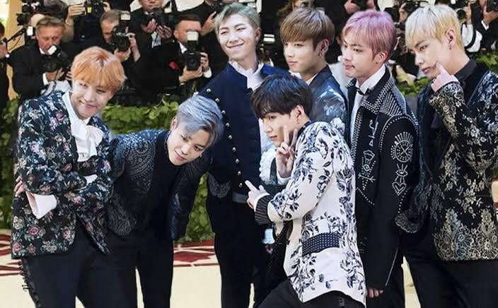 What outfits have the members worn that would fit right in at the Met Gala?