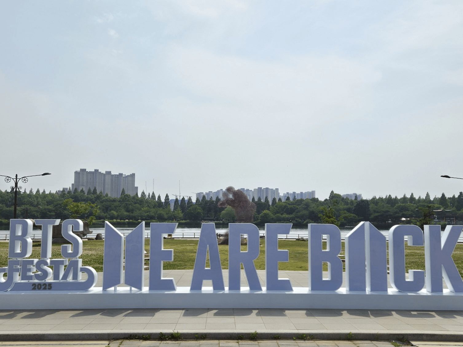 A "BTS FESTA 2025 WE ARE BACK" sign has been put up near KINTEX Hall for 2025 BTS FESTA